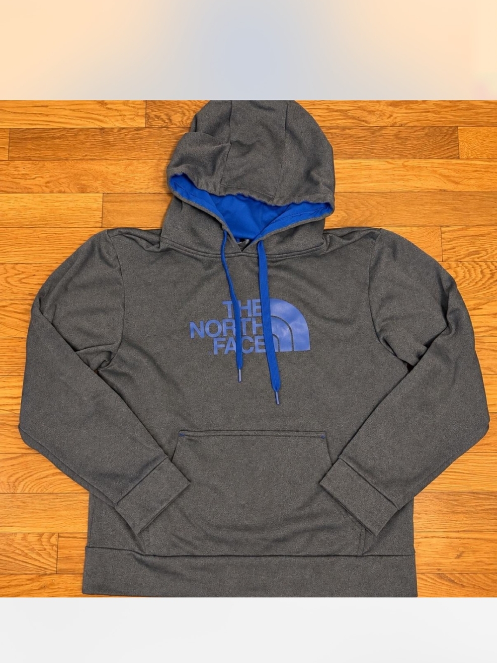 The North Face Charcoal Gray Pullover Hoodie with Blue Logo and Lining